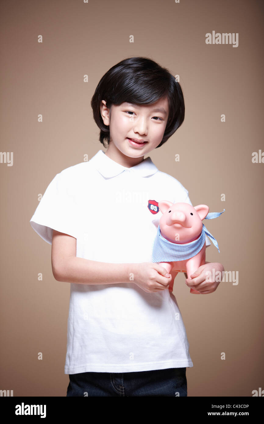 girl holding piggy bank Stock Photo - Alamy