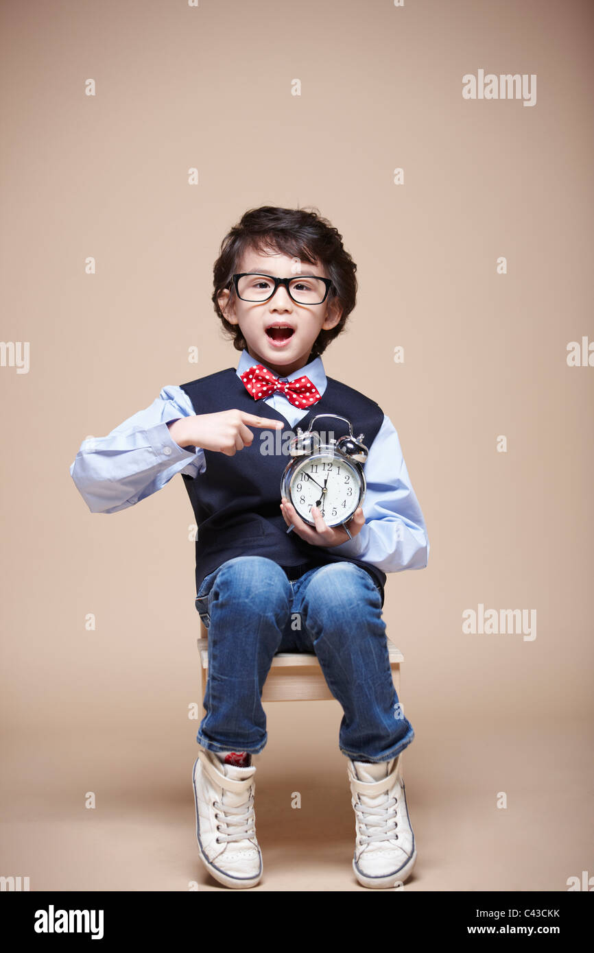 boy pointing at clock Stock Photo Alamy