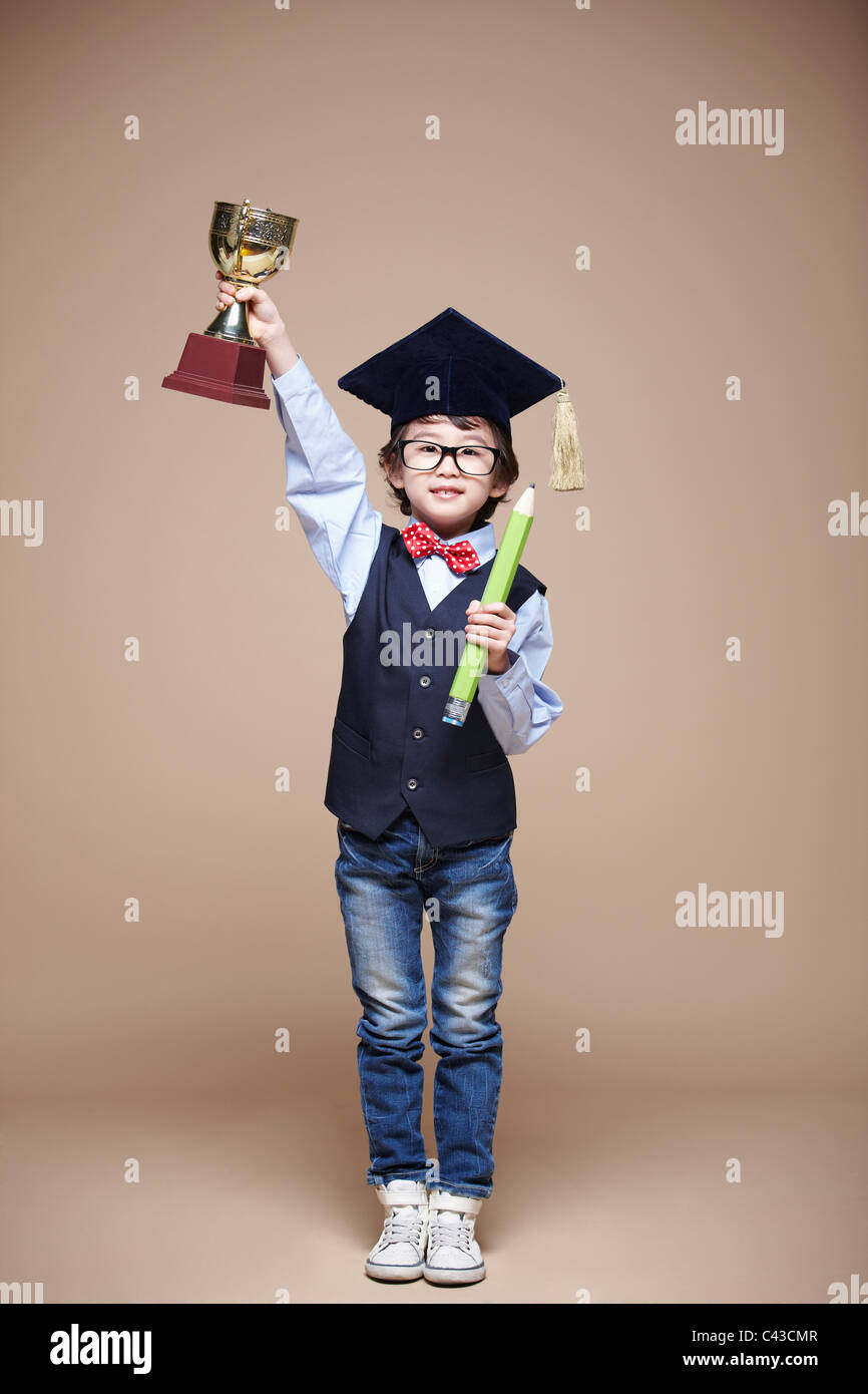 Boy wearing graduation cap hi-res stock photography and images - Alamy