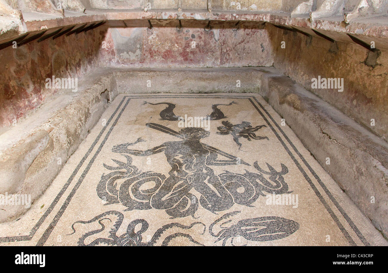 Floor mosaic at the baths at Herculaneum, depicting a mythical sea-god (Triton or Typhon?) and other sea creatures Stock Photo