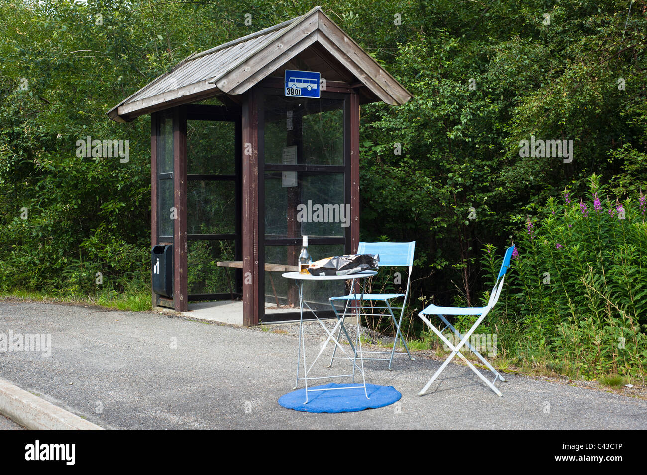 Café table by bus stop Stock Photo - Alamy