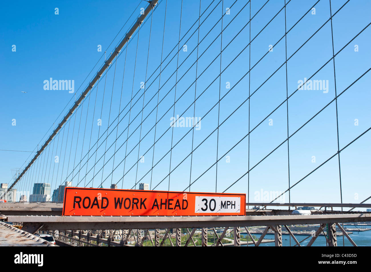 Road work ahead-sign on Brooklyn Bridge, New York Stock Photo