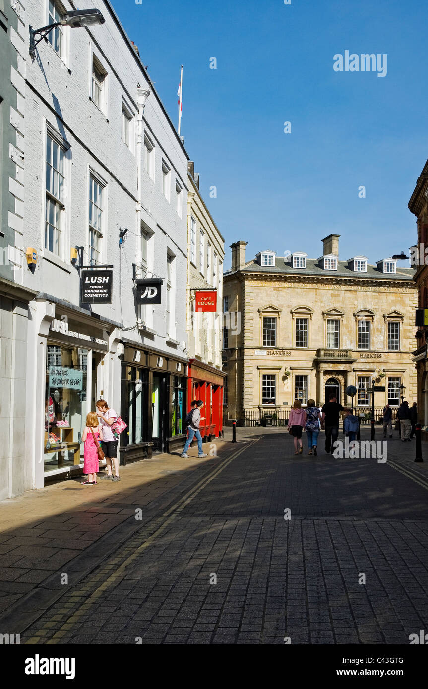 Stores shops along Coney Street in the city town centre looking towards