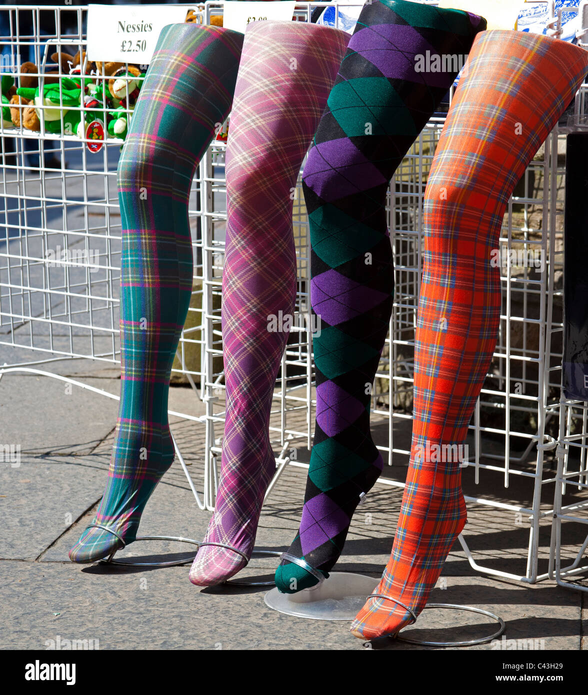 https://c8.alamy.com/comp/C43H29/edinburgh-tartan-stocking-legs-shop-display-C43H29.jpg