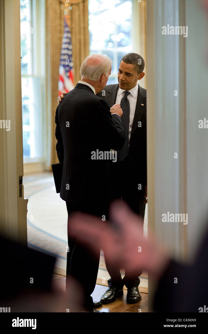 President Obama talks alone with Vice President Joe Biden in the doorway of the Oval Office, Oct. 6, 2009. Stock Photo