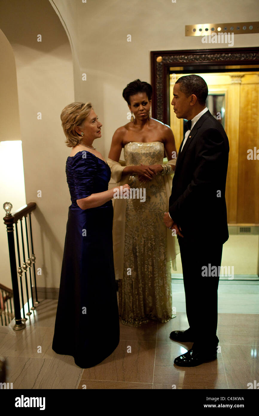 Secretary of State Hillary Rodham Clinton confers with President Barack Obama and First Lady Michelle Obama Stock Photo