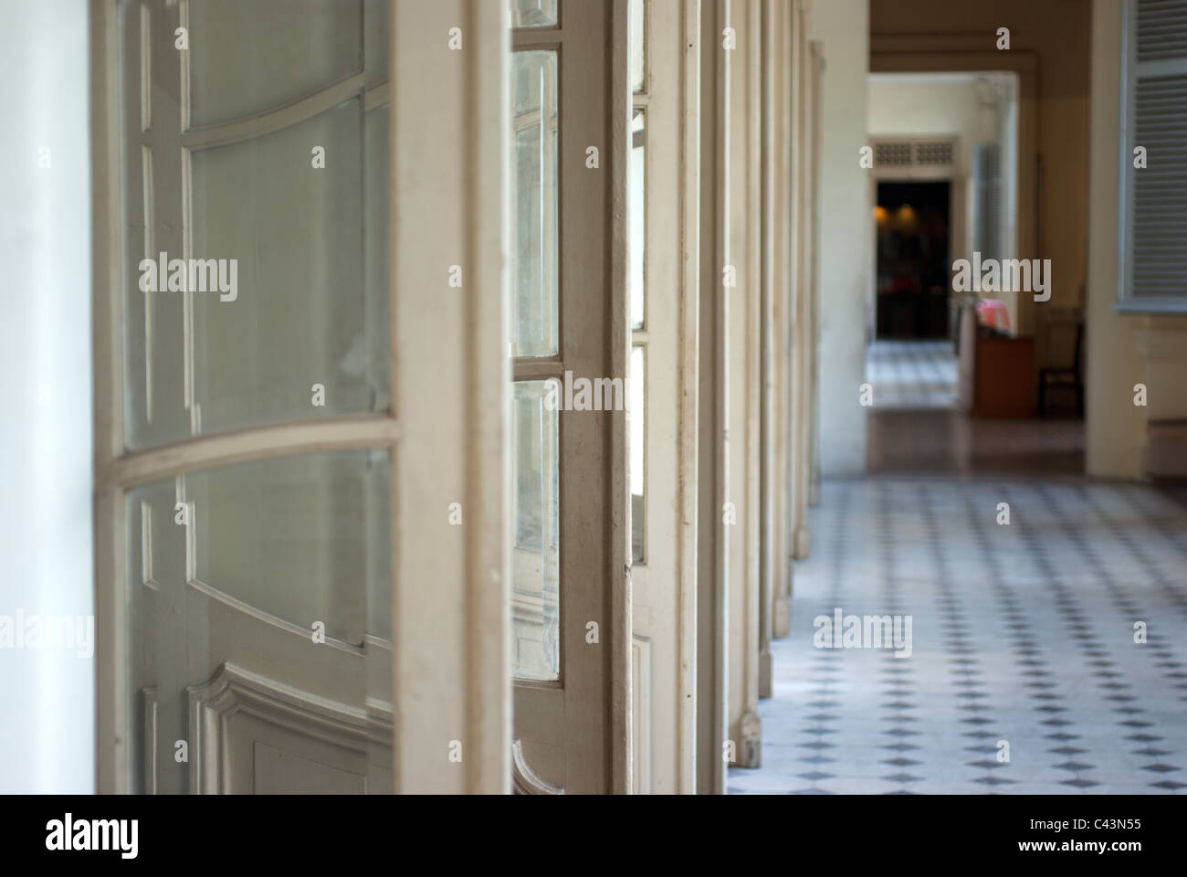 French doors aligned in a hall way at War Museum in Ho Chi Minh city Vietnam Stock Photo