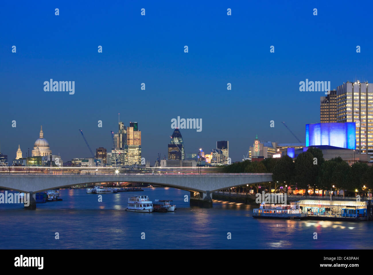 The City skyline, the Thames, London bridge at night; London; England Stock Photo