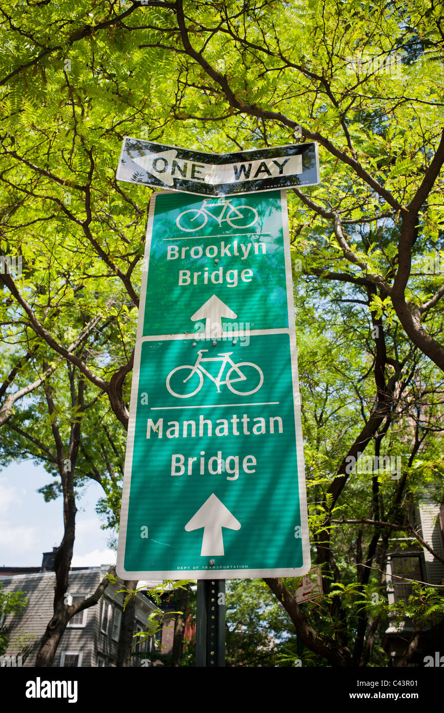 Bike route signs directing cyclists to the Brooklyn and Manhattan Bridges is seen in the Brooklyn Heights neighborhood of NY Stock Photo