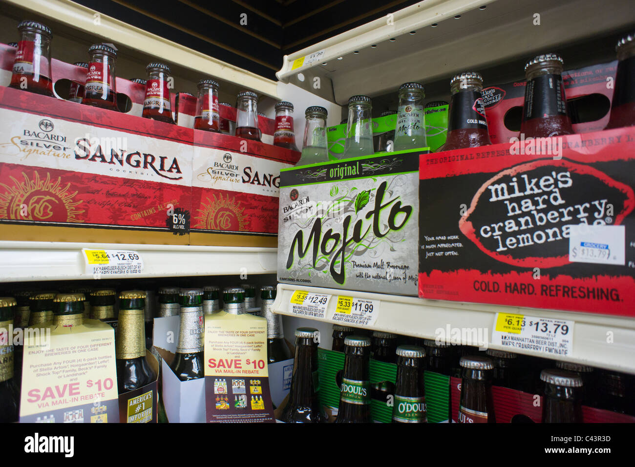 Sixpacks of flavored malt beverages are seen on a grocery store shelf in New York Stock Photo