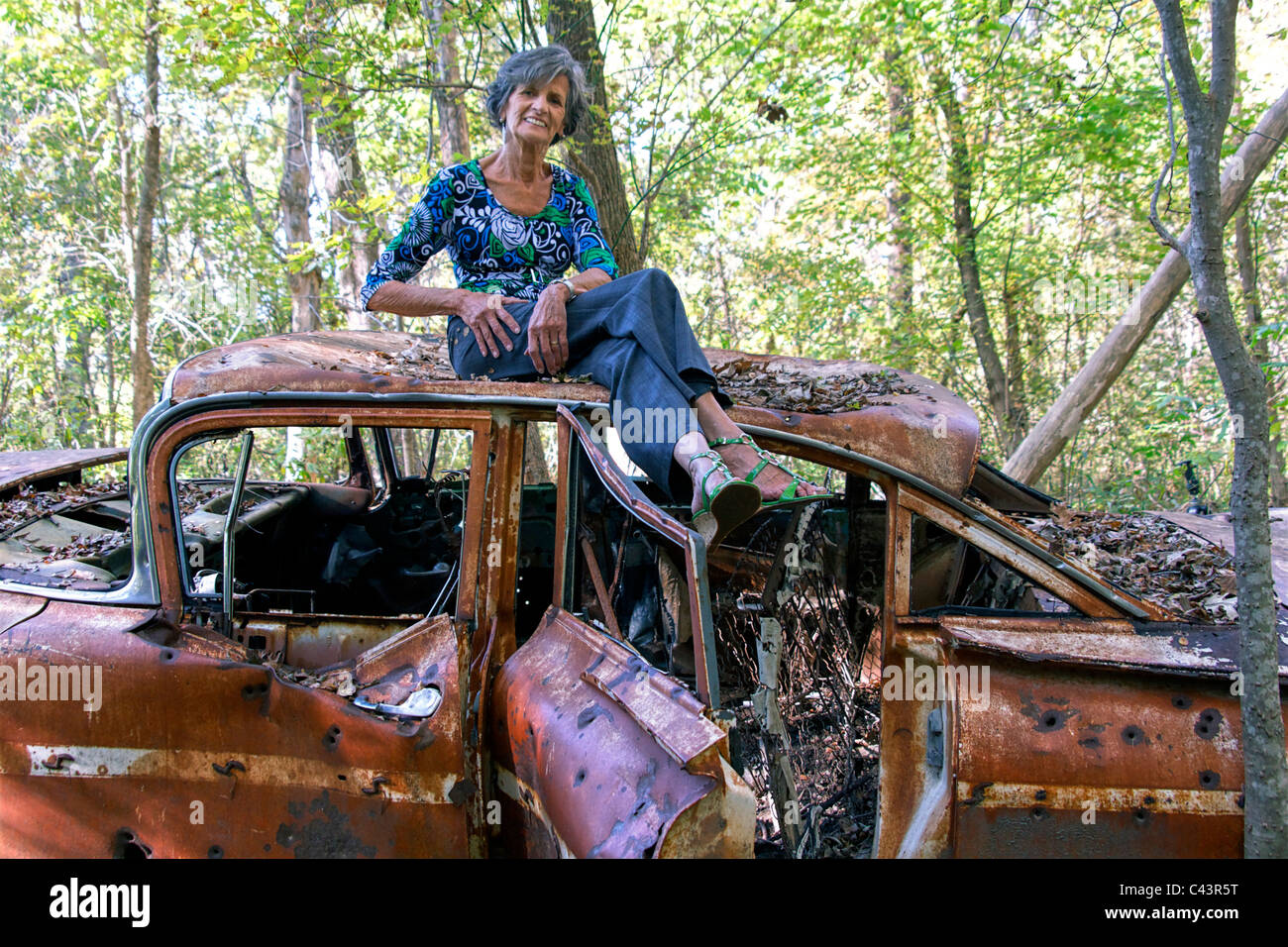 happy, having fun, healthy, wood, outdoors, sitting, rusty, car, laughing, model released, old woman, radiant, senior, slender, Stock Photo