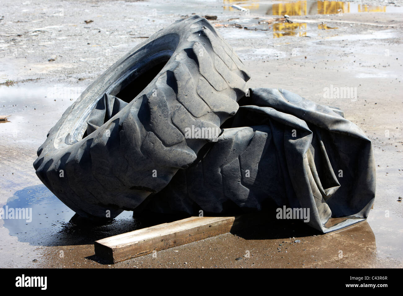 discarded punctured large vehicle tyres Stock Photo