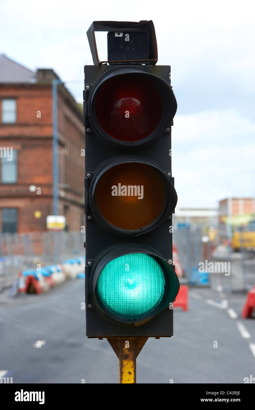 temporary traffic lights in the uk showing green Stock Photo Alamy