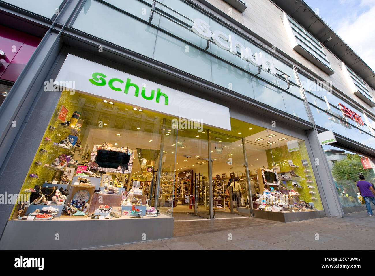 The storefront of the high street retailer Schuh on Market Street, Manchester. (Editorial use only). Stock Photo