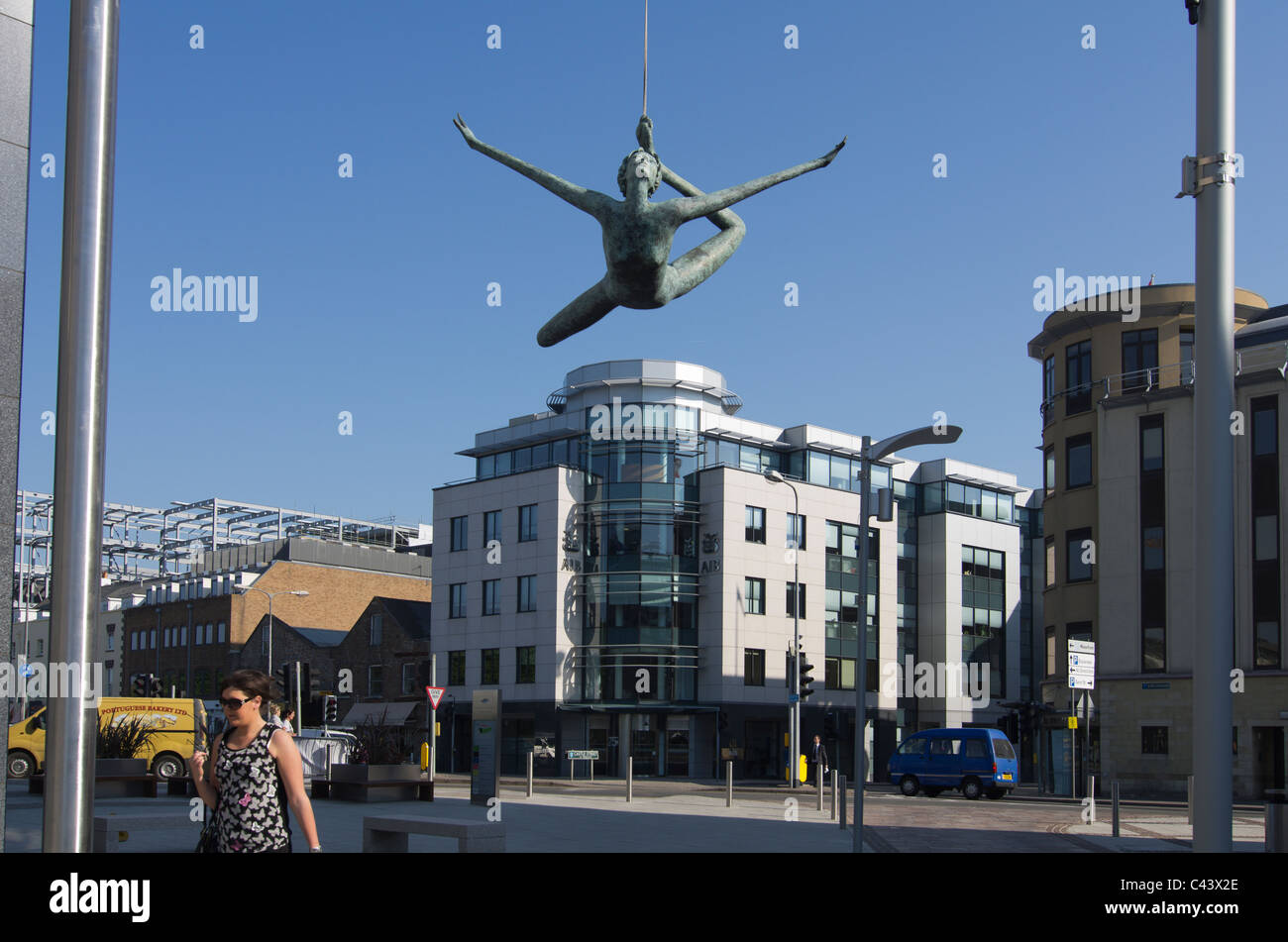 The Allied Irish Bank building on Castle Street, St Helier, Jersey with the Jersey Girl sculpture in the foreground Stock Photo