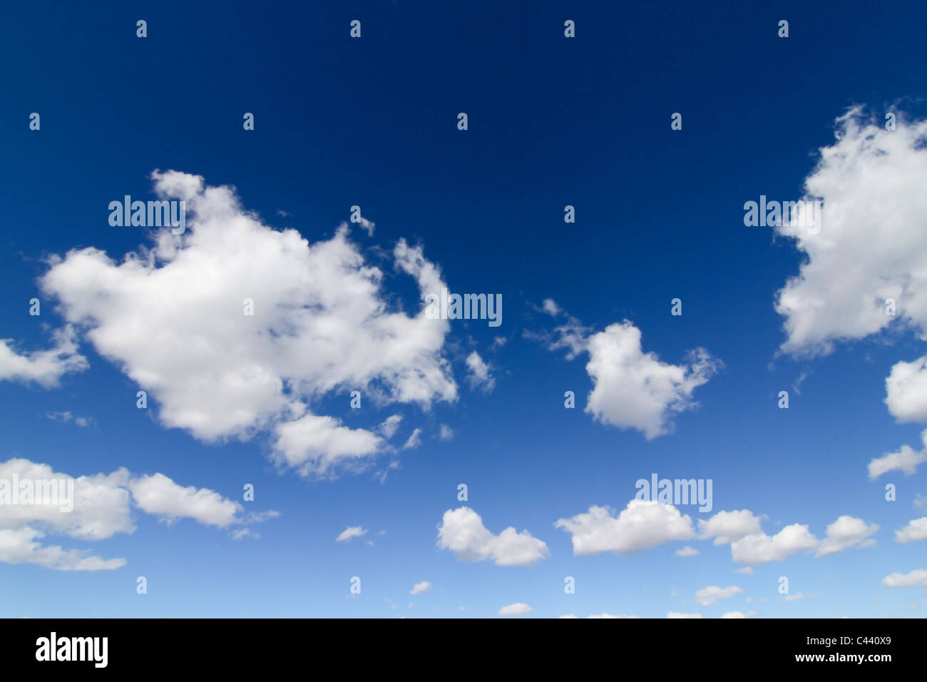 Blue sky with white fluffy cumulus clouds Stock Photo - Alamy