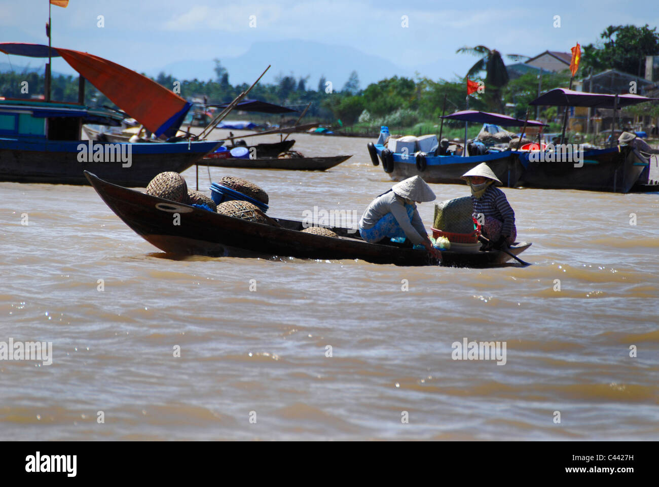 Vietnam Mekong Delta boat people working Stock Photo - Alamy