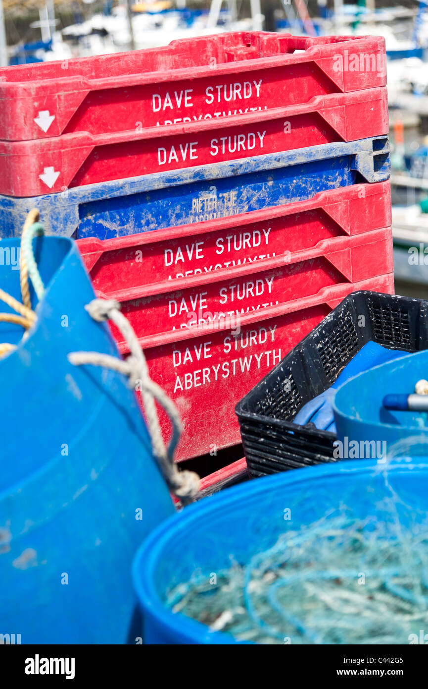 Plastic trays for holding fresh caught fish on the quayside at Aberystwyth, Ceredigion, Wales UK Stock Photo