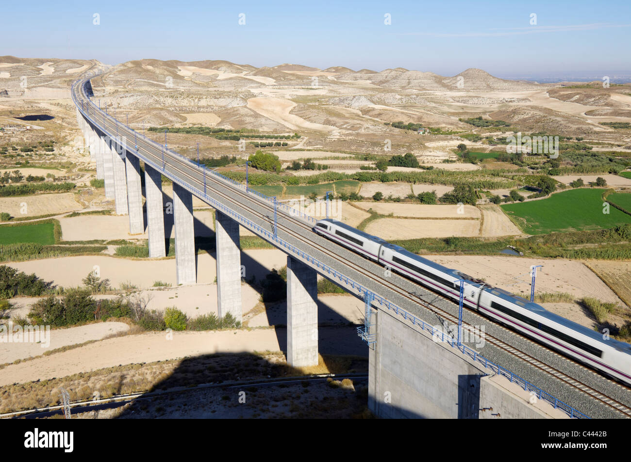 view of a high-speed train crossing a viaduct in Spain Stock Photo
