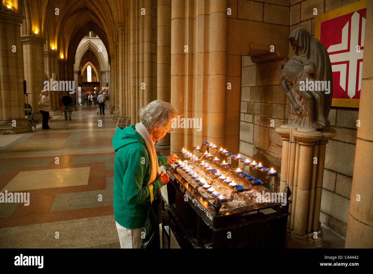 Old lady lighting a candle, Truro Cathedral, Truro, Cornwall Stock Photo Alamy