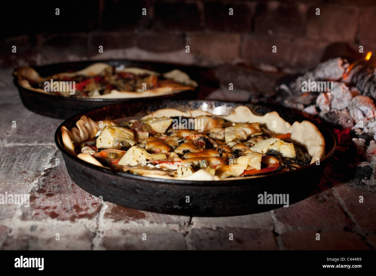 Pizzas cooking in a stone oven Stock Photo Alamy