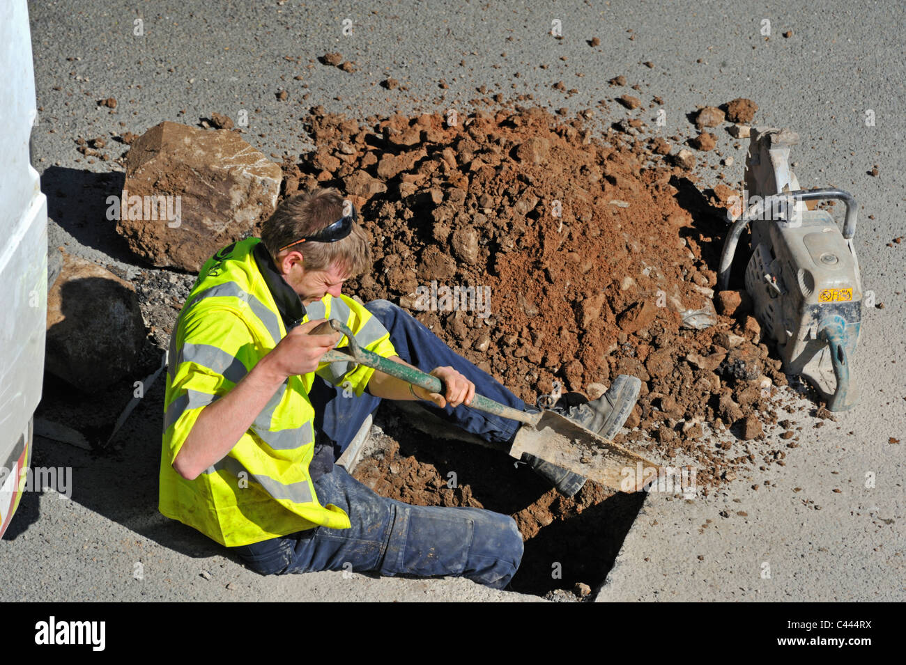 United Utilities operative investigating domestic water leak. Stock Photo