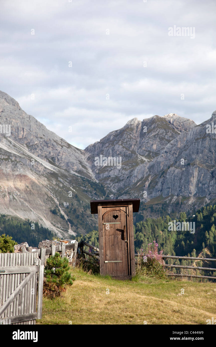 An outhouse in a mountain setting Stock Photo