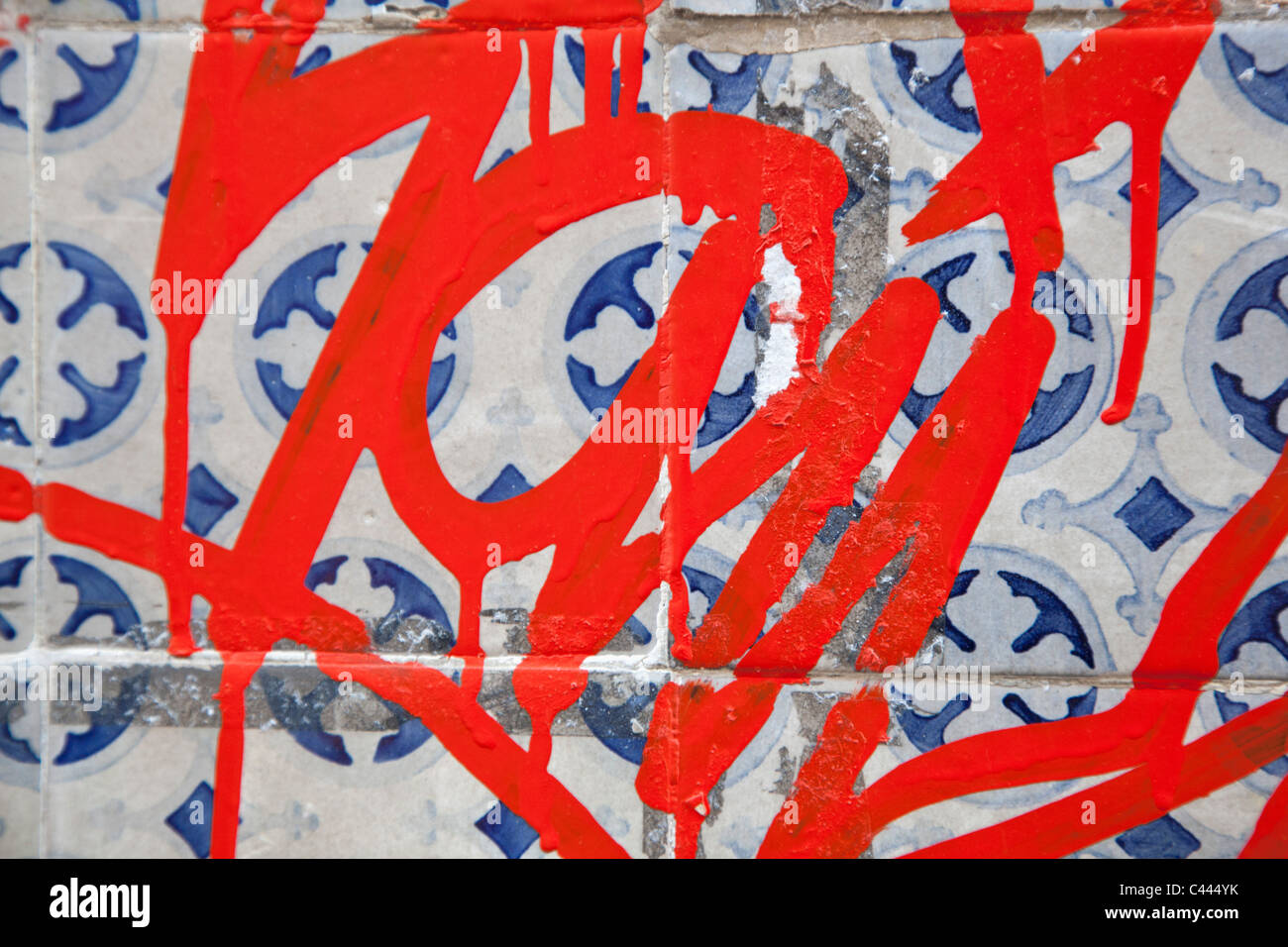 Detail of a graffiti tag on patterned tiles Stock Photo