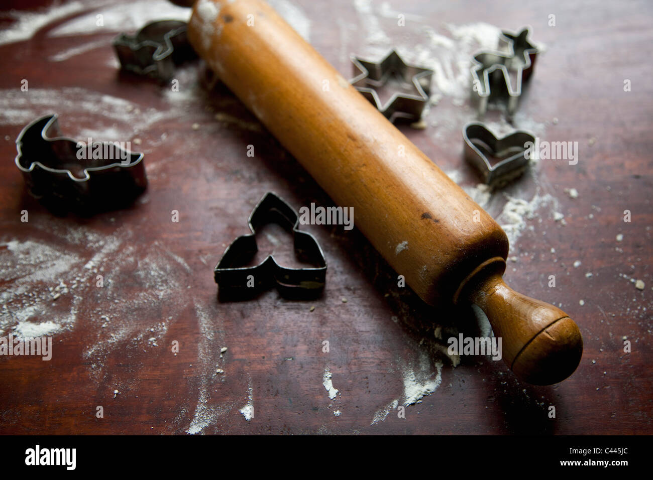 A rolling pin and cookie cutters on a kitchen bench Stock Photo Alamy
