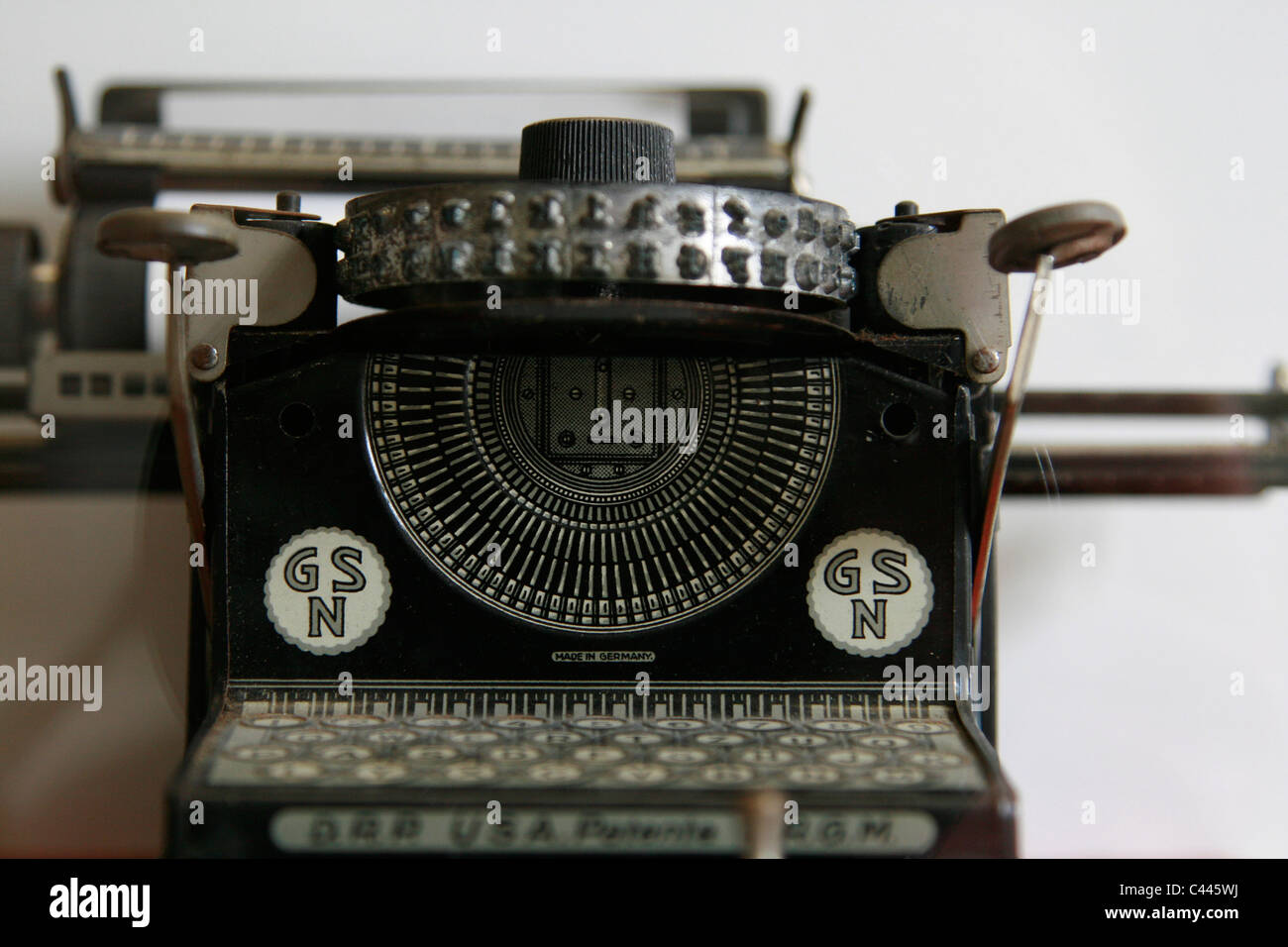 Close up of a german toy typewriter 'GSN Junior' from 1925 with 2-row type wheel displayed in the toy museum in Prague, Czech Republic, Europe Stock Photo