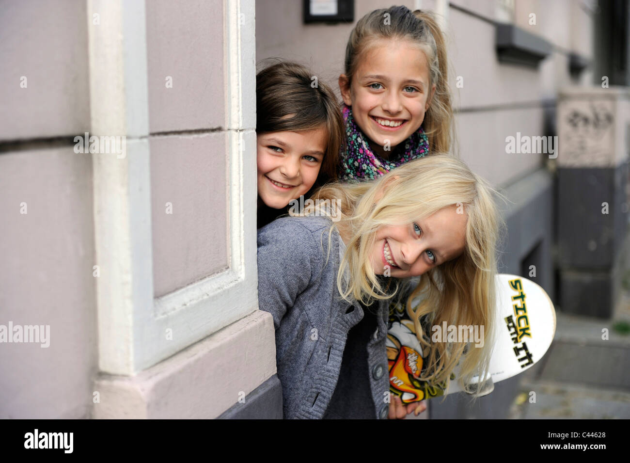 Children five to nine, playing in the city on a residential road in Duesseldorf, Germany. Stock Photo
