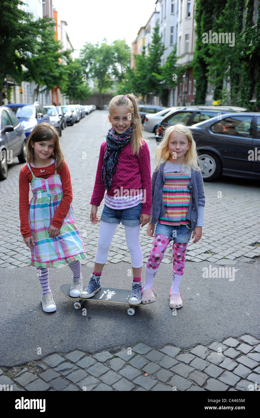 Children of five to nine, playing in the city on a residential road in Duesseldorf, Germany. Stock Photo