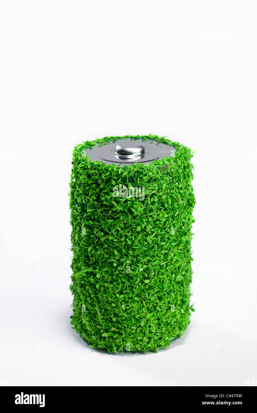 Energy saving battery covered in green grass Stock Photo