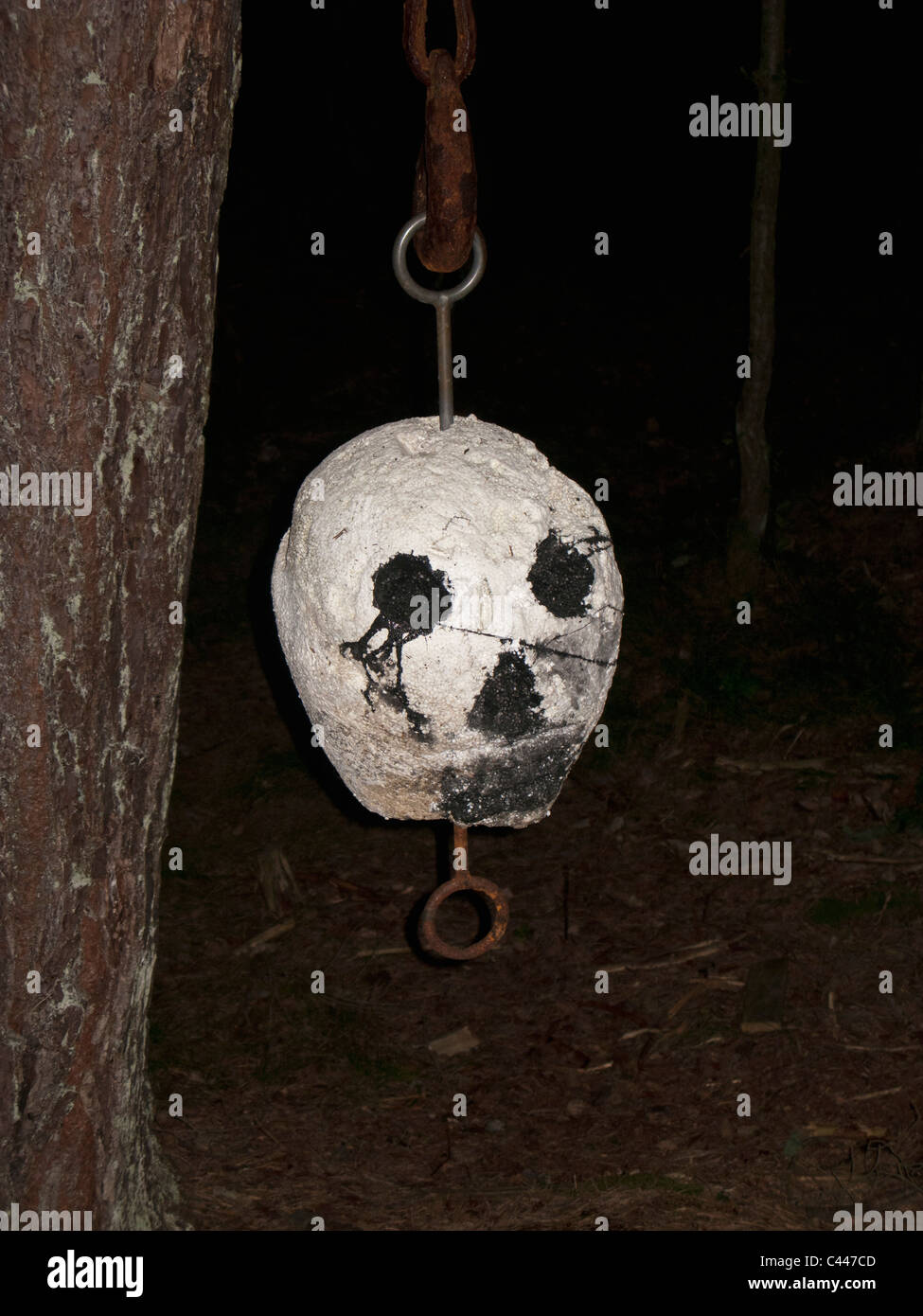 Scary mask hanging from tree Stock Photo Alamy
