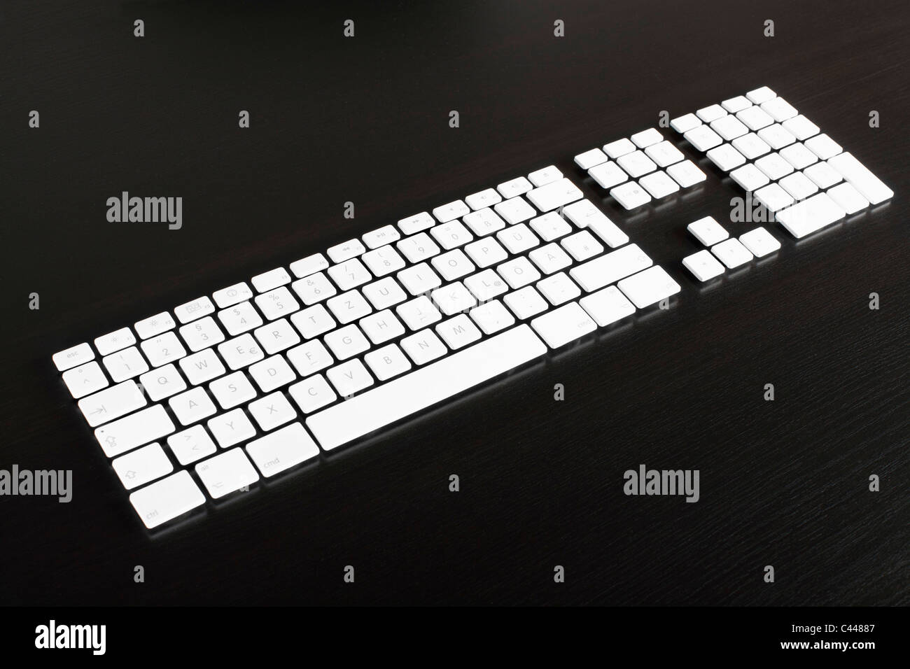 Separate computer keys arranged to look like an actual keyboard Stock