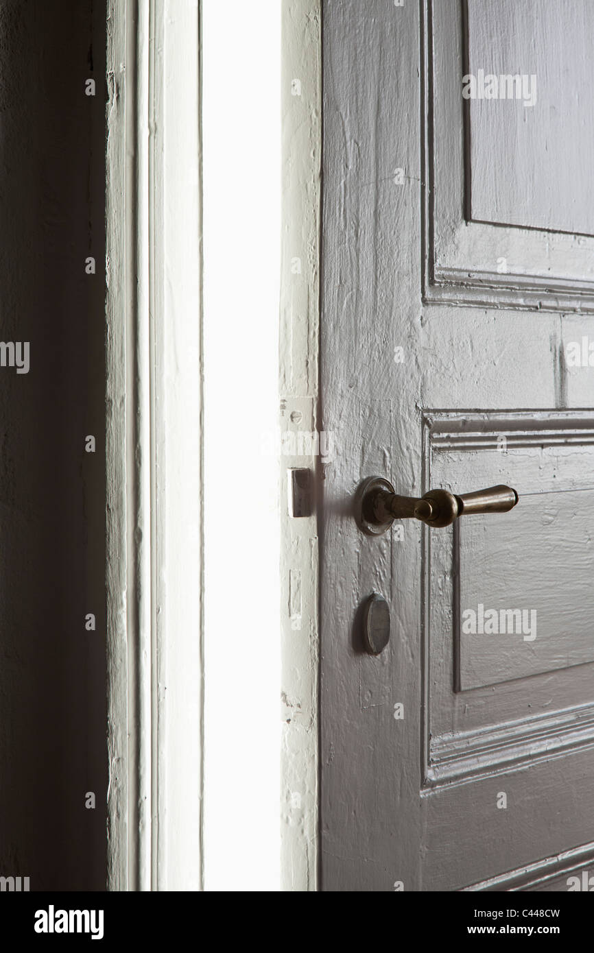 A bright light emitting from a door left ajar Stock Photo Alamy