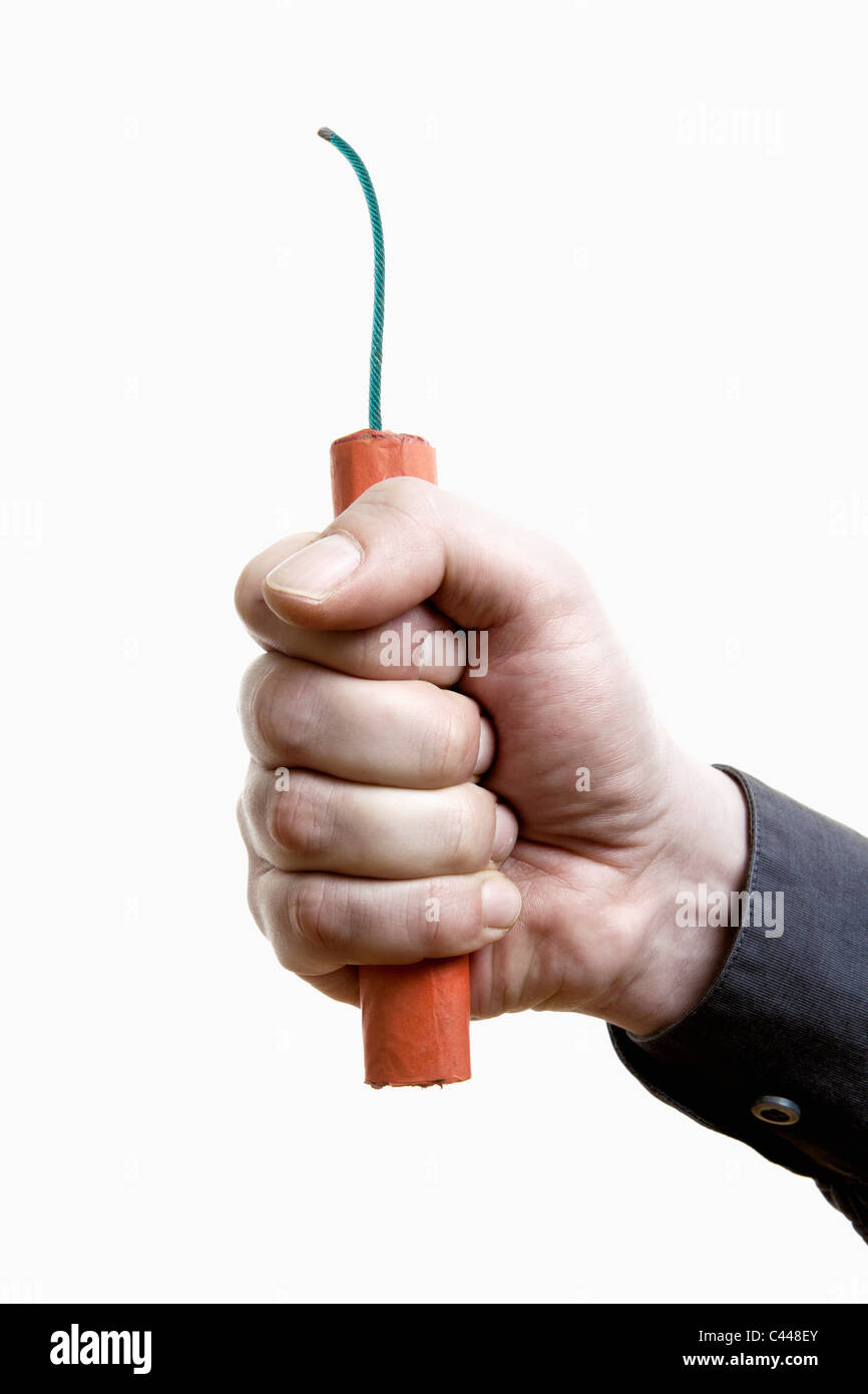 A man holding out a stick of dynamite, close-up of hand Stock Photo