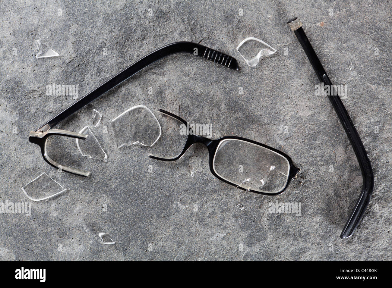 A broken pair of glasses Stock Photo Alamy