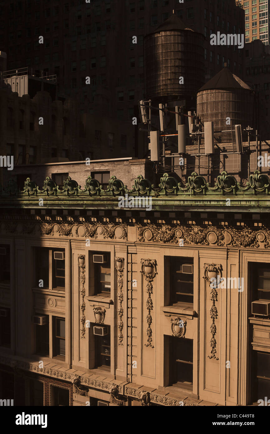 Old-fashioned wooden water storage tanks on the roof of a luxury