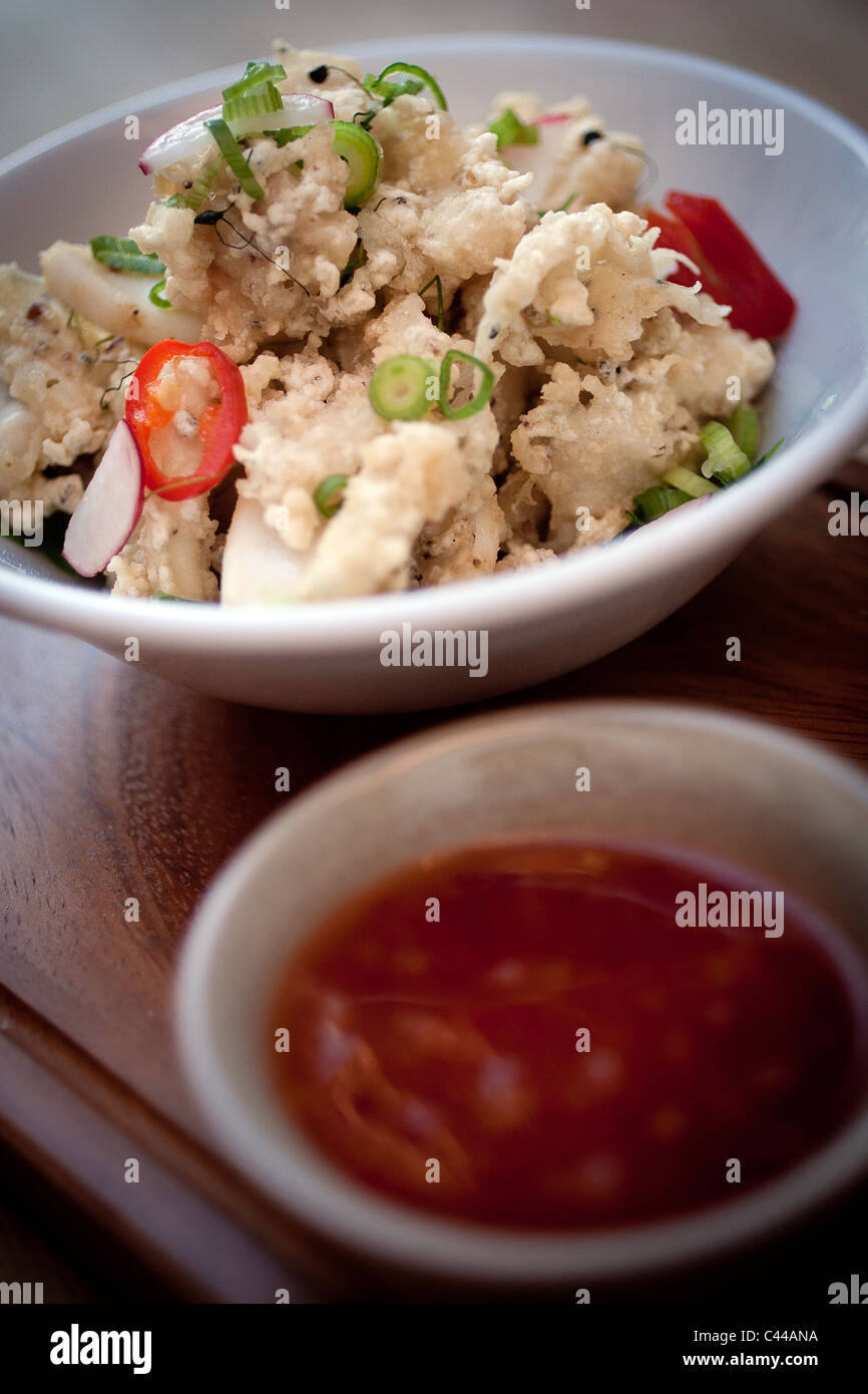 A dish of deep fried and battered calamari squid, served with Chili