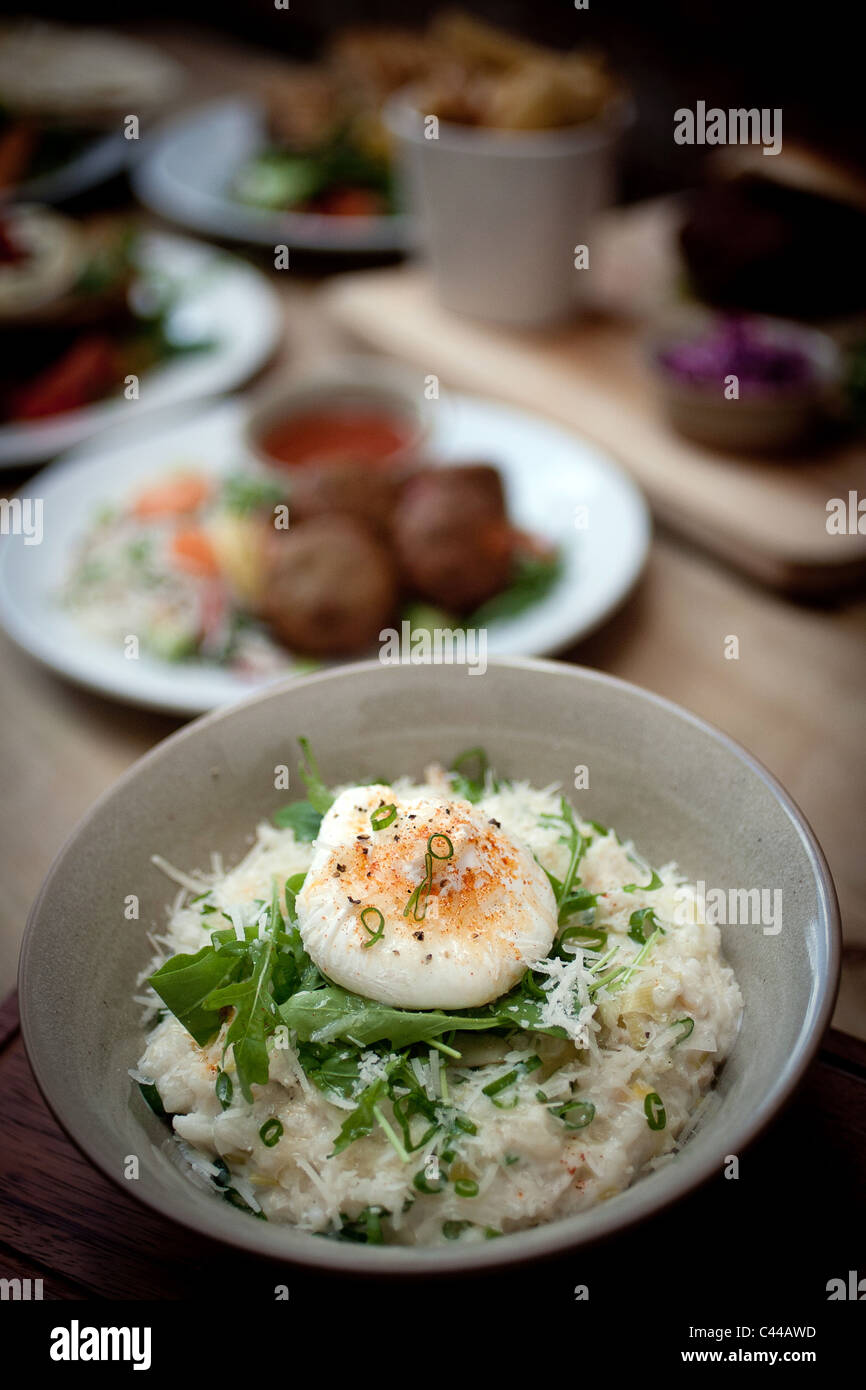 Smoked Haddock risotto served with a poached egg Stock Photo Alamy