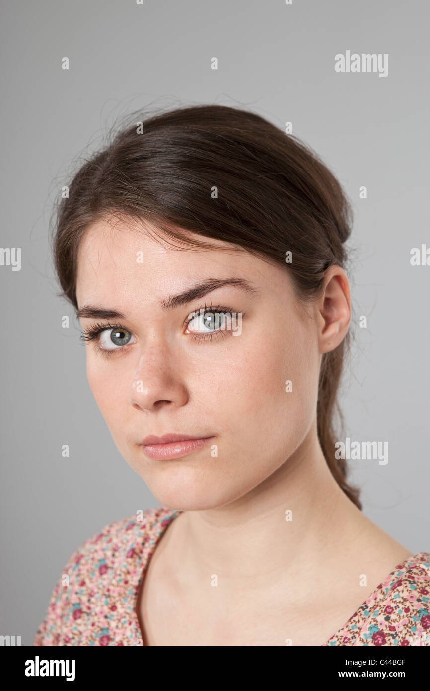 A woman looking seriously into the camera Stock Photo
