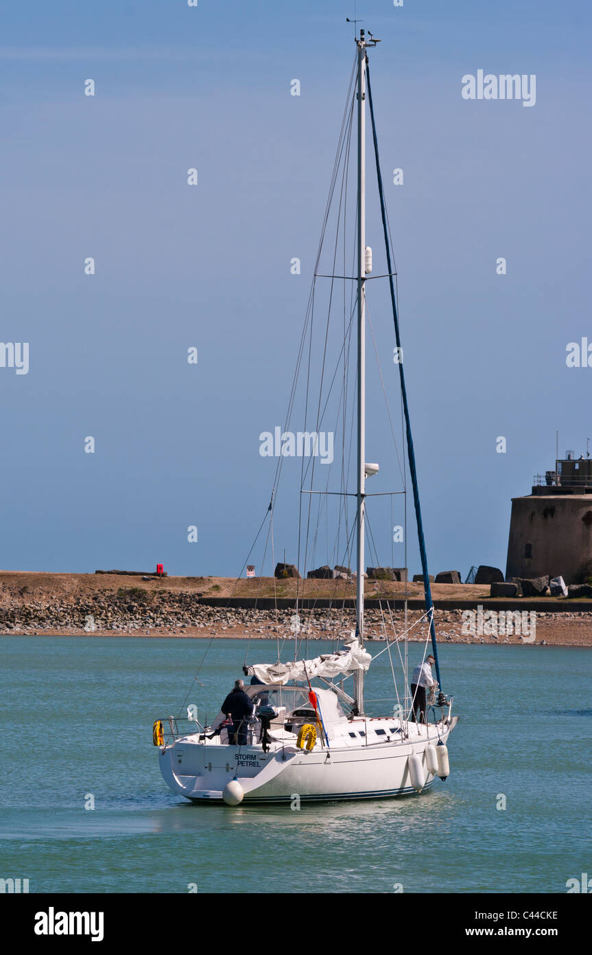 Sailing Yacht With Crew and The Sails Down Stock Photo Alamy