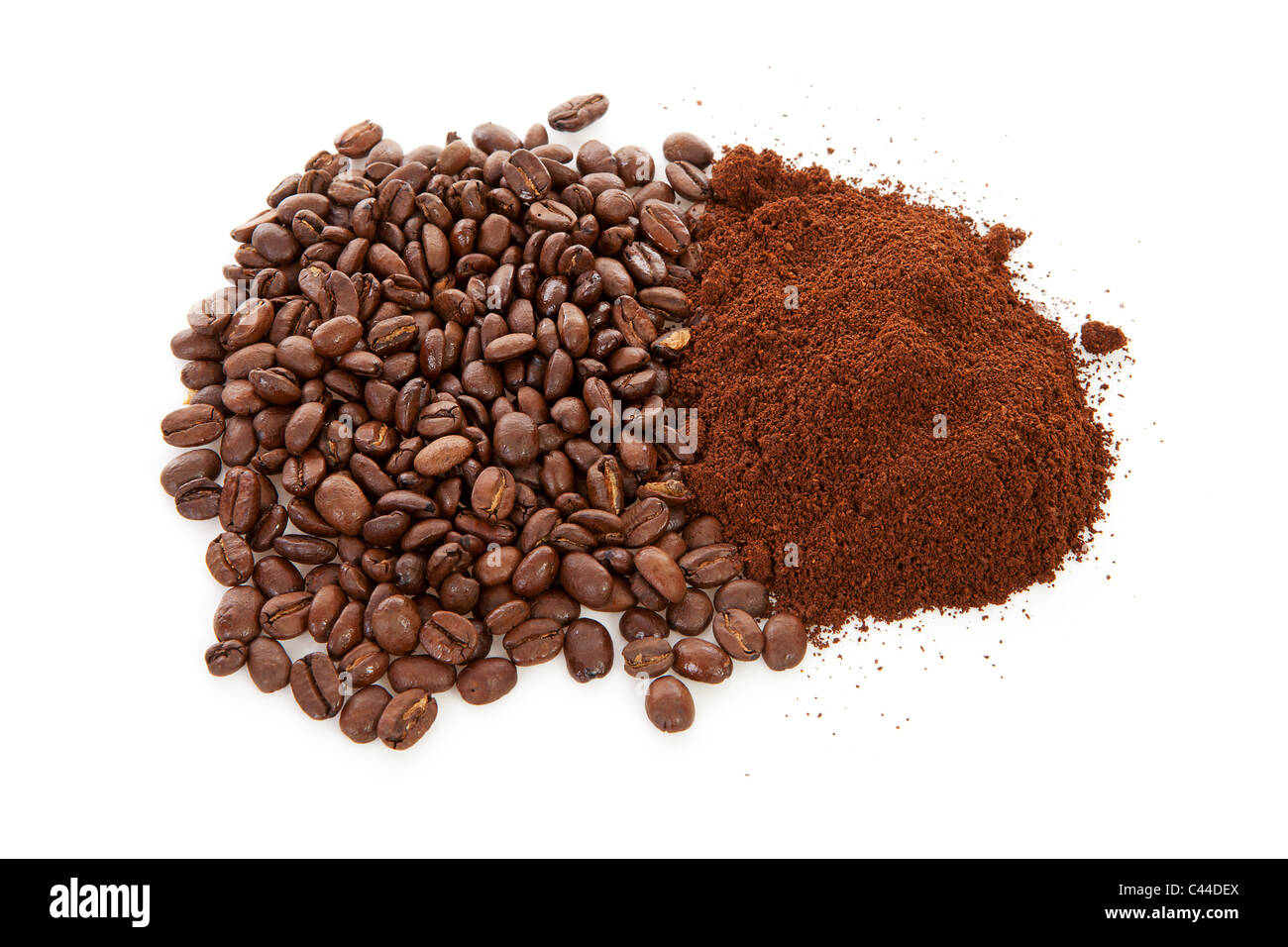 Pile of ground coffee and beans over white background Stock Photo - Alamy