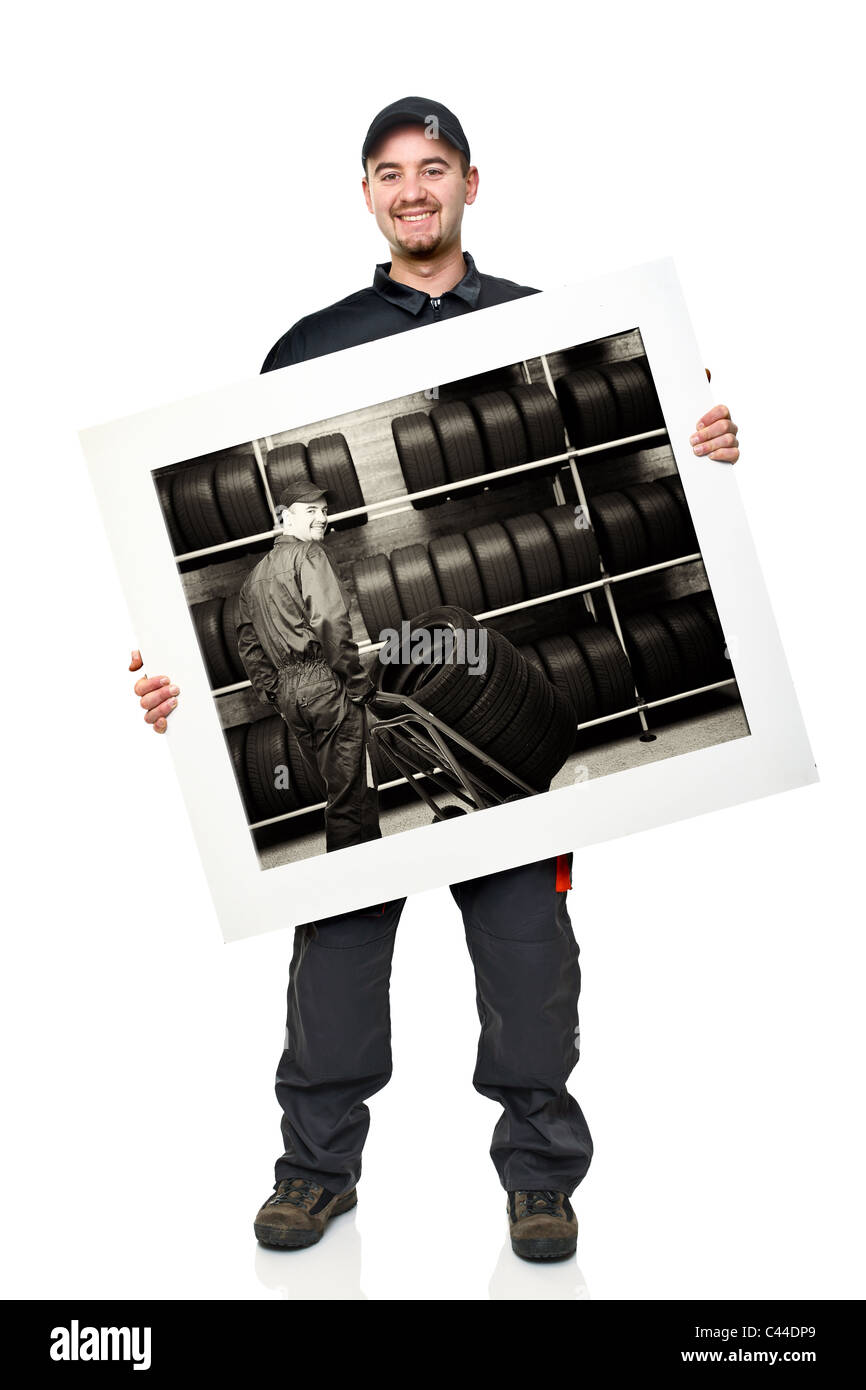 standing caucasian manual worker holding garage picture Stock Photo