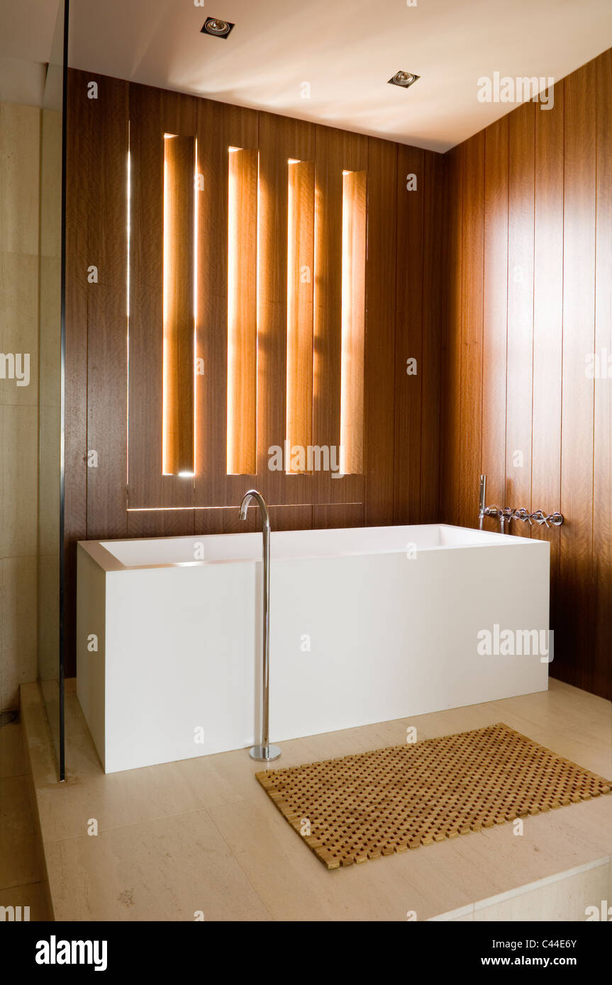 Minimal Modern Bathroom With Wooden Wall Panelling And Corian