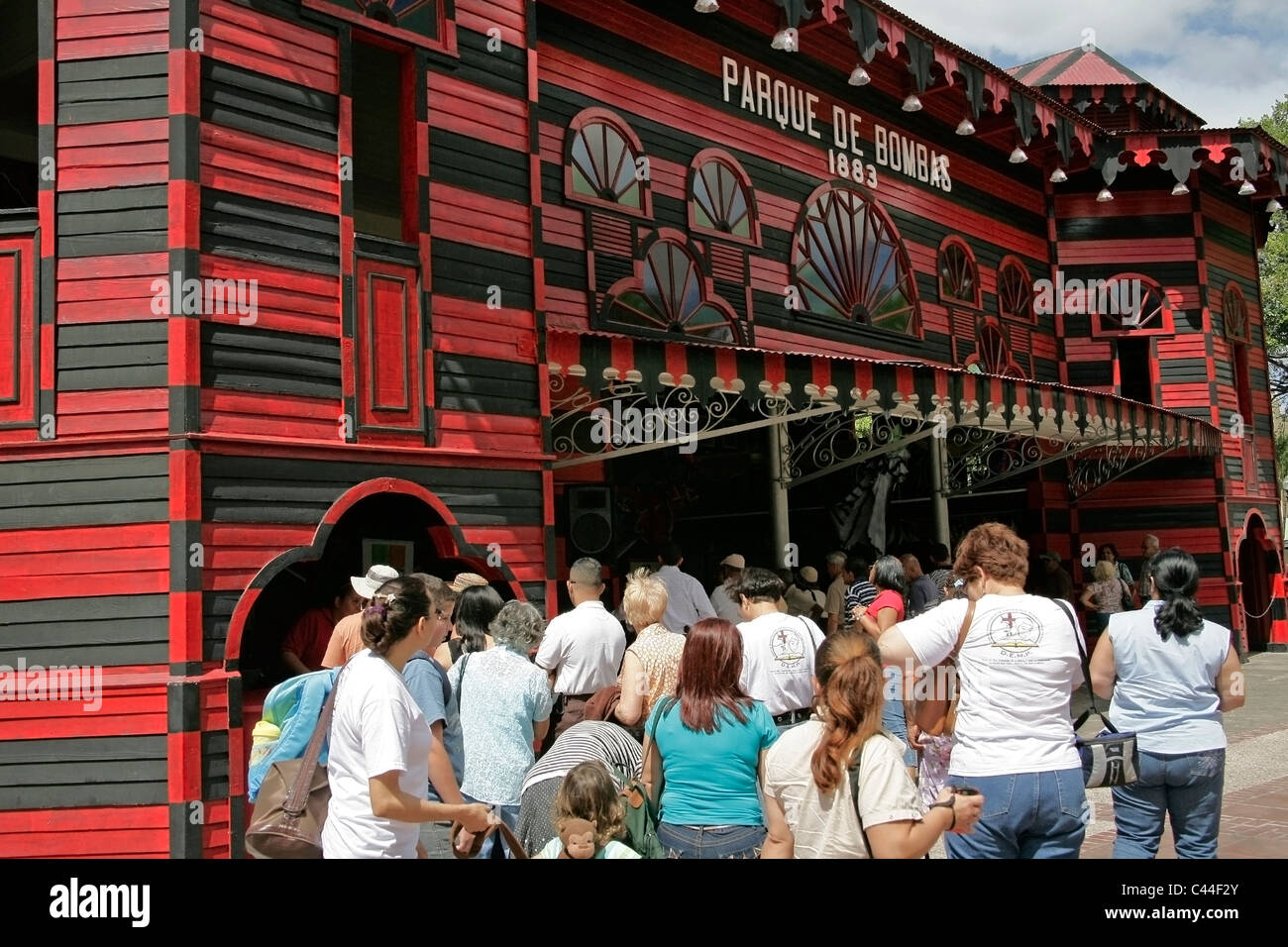 People in line to visit the Parque de Bombas or Park of Pumps Museum during  Carnival in Ponce Puerto Rico Stock Photo - Alamy