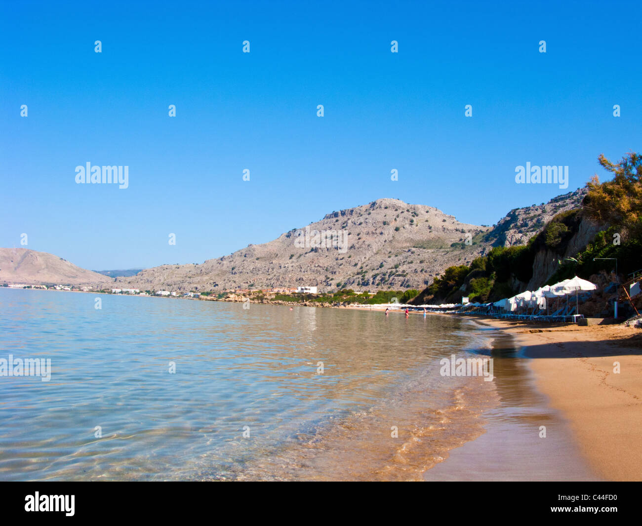 EARLY MORNING ON PEFKOS BEACH NEAR LINDOS IN RHODES GREECE Stock Photo
