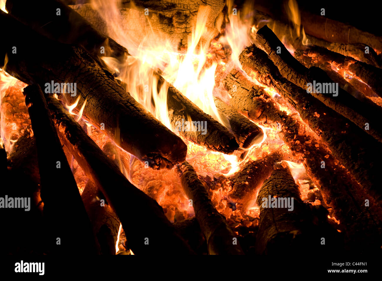 Bonfire flame on dark background close up Stock Photo - Alamy