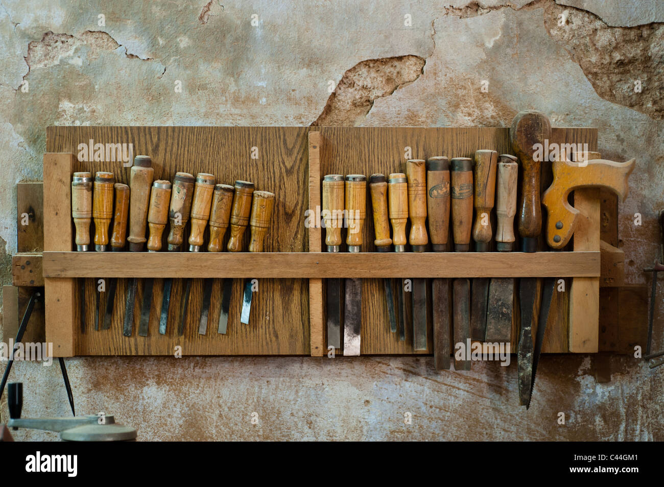 A rack of chisels and other carpentry tools hang on a carpentry shop wall  in the old city of Nazareth, Israel Stock Photo - Alamy